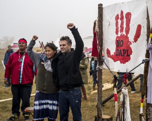 Two people with fists raised int he air